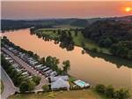 An aerial view of the campsites by the river at TWO RIVERS LANDING RV RESORT - thumbnail