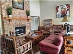 A seating area by the fireplace at TWO RIVERS LANDING RV RESORT - thumbnail