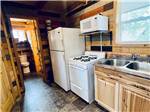 The kitchen and restroom of one of the cabins at KLONDIKE RV PARK & COTTAGES - thumbnail