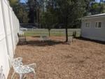 Metal chairs in a sitting area at BRIARCLIFFE RV RESORT - thumbnail