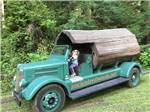 A small girl driving a truck at ANCIENT REDWOODS RV PARK - thumbnail