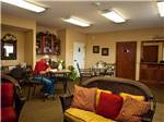 Inside lodge with comfy living space at EZ DAZE RV PARK - thumbnail