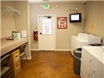 Laundry room with washer and dryers at EZ DAZE RV PARK - thumbnail