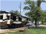 A fifth wheel trailer in an RV site at BENNETT'S RV RANCH - thumbnail