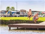 Kids swimming at THOUSAND TRAILS LAKE CONROE - thumbnail
