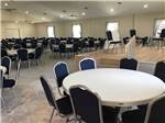 A lot of round tables in the rec hall at COASTAL GEORGIA RV RESORT - thumbnail