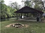 A covered pavilion by the river at CEDAR CREEK RV & OUTDOOR CENTER - thumbnail