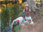 A family fishing in the river at CEDAR CREEK RV & OUTDOOR CENTER - thumbnail