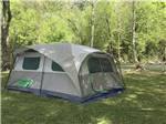 A tenting area by the river at CEDAR CREEK RV & OUTDOOR CENTER - thumbnail