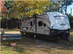 A travel trailer parked at a campsite at ATLANTIC BLUEBERRY RV PARK - thumbnail