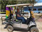 A golf cart decorated for Mardi Gras at ATLANTIC BLUEBERRY RV PARK - thumbnail
