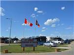 Flagpoles at entrance of RV park at ST. ALBERT RV PARK - thumbnail