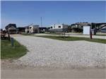 Empty gravel site with picnic bench at ST. ALBERT RV PARK - thumbnail