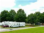 Trailers camping with grassy area at RIVERSIDE GOLF & RV PARK - thumbnail