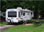 Fifth wheel parked in a campsite at CHESAPEAKE CAMPGROUND - thumbnail