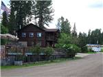 Two-story wooden building overlooks a pool at FISH'N FRY CAMPGROUND & RV PARK - thumbnail