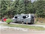 Class C motorhome and jeep in site at CAMPGROUND ST REGIS - thumbnail