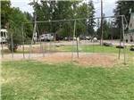 Swing set in grassy play area at CAMPGROUND ST REGIS - thumbnail