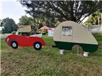 A cut-out of a car and trailer at TRAVELERS CAMPGROUND - thumbnail