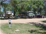 A dirt RV site with hookups at DAKOTA CAMPGROUND - thumbnail