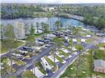 An aerial view of the paved RV sites and lake at FLORIDA CAVERNS RV RESORT AT MERRITT'S MILL POND - thumbnail