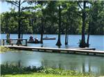 People fishing from boats at FLORIDA CAVERNS RV RESORT AT MERRITT'S MILL POND - thumbnail