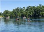 People paddling on kayaks at FLORIDA CAVERNS RV RESORT AT MERRITT'S MILL POND - thumbnail