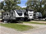 A row of travel trailers parked in sites at ALL SEASONS RV PARK - thumbnail