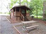 One of the rustic rental cabins at MIDWAY CAMPGROUND & RV RESORT - thumbnail