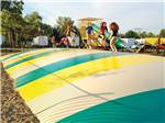 Playground with swing set at YOGI BEAR'S JELLYSTONE PARK CAMP-RESORT - thumbnail