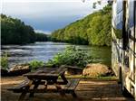 An RV site by the river at HIDDEN ACRES FAMILY CAMPGROUND - thumbnail