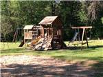 Playground with swing set at SHERWOOD FOREST CAMPING & RV PARK - thumbnail