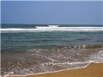 Small waves crashing on the beach at HATTERAS SANDS CAMPGROUND - thumbnail