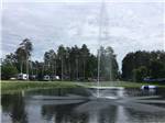 View of lake with fountain at STONY POINT RESORT RV PARK & CAMPGROUND - thumbnail
