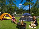 Girls in tents camping at HOLIDAY TRAV-L-PARK - thumbnail