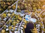 Aerial view of RVs parked in lush sites landscapes with pools at BLUEWAY RV VILLAGE - thumbnail