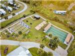 Aerial shot of four shuffleboard courts and RV campground at BLUEWAY RV VILLAGE - thumbnail