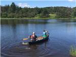 Two people in a canoe at PONDEROSA PINES CAMPGROUND - thumbnail