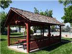 A small pavilion with picnic benches at MOUNTAIN SHADOWS RV PARK & MHP - thumbnail
