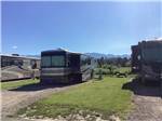 RVs parked in gravel sites at ROCKY MOUNTAIN 'HI' RV PARK AND CAMPGROUND - thumbnail