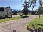 An empty gravel RV site at ROCKY MOUNTAIN 'HI' RV PARK AND CAMPGROUND - thumbnail