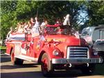 People riding in a fire truck at LONE PINE CAMPSITES - thumbnail