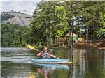A man kayaking on the water at STONE MOUNTAIN PARK CAMPGROUND - thumbnail