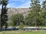 Picnic benches by the river at RIVERBEND RV PARK OF TWISP - thumbnail