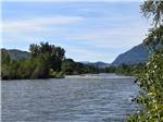 The river with mountains in the background at RIVERBEND RV PARK OF TWISP - thumbnail