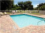 Swimming pool at campground with fence around at ENCORE BULOW RV - thumbnail