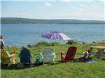 Sitting lakeside in Adirondack chairs at BRAS D'OR LAKES CAMPGROUND ON THE CABOT TRAIL - thumbnail