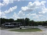 Fifth wheel in an RV spot with lovely skies at DALLAS NE CAMPGROUND - thumbnail