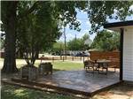 Outdoor patio with picnic table at DALLAS NE CAMPGROUND - thumbnail