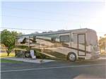 Large RV camping with bike on the side at ENCORE ALAMO PALMS - thumbnail